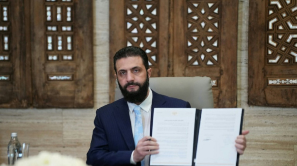 Syria's leader agrees truce with Kurds after govt troops advance