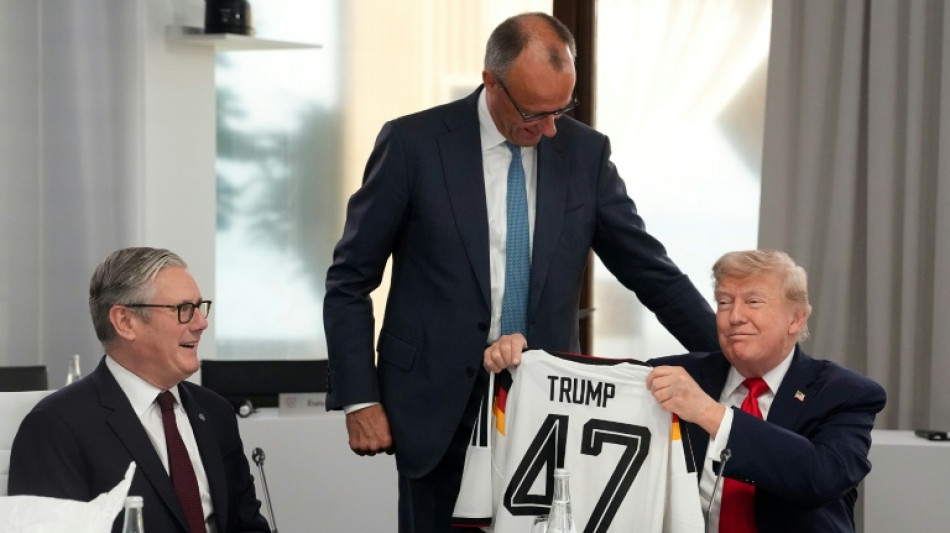 'On same team': Merz gifts Trump German football jersey