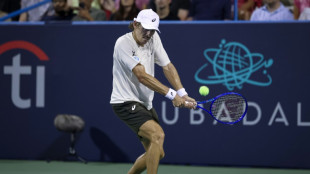 De Minaur battles to DC Open crown