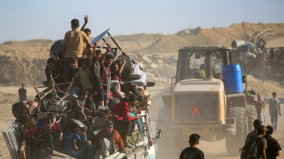 Palestinians return to devastated Gaza City as truce holds