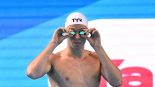 'Struggling' Marchand targets second gold at swimming worlds