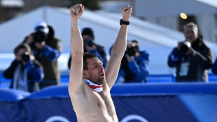 Karl defends Olympic men's parallel giant slalom crown