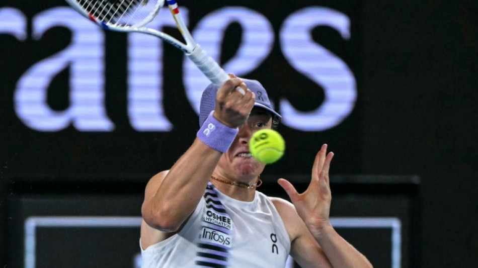 Swiatek survives roller coaster to reach Australian Open last 16